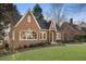 Red brick house with white trim and green door at 1093 Lanier Ne Blvd, Atlanta, GA 30306