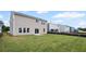Newly constructed home with a level green backyard and sliding door access at 123 Cherry Glen Way, Euharlee, GA 30145