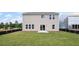 The new construction home has a level and green backyard and sliding door access at 123 Cherry Glen Way, Euharlee, GA 30145
