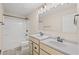 Bright bathroom with double vanity, marble floors, tub and shower combo, and modern lighting at 123 Cherry Glen Way, Euharlee, GA 30145