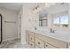 Modern bathroom with double vanity, marble tile floor, and a black framed shower at 123 Cherry Glen Way, Euharlee, GA 30145