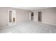 A spacious bedroom with carpet and open entryways to bathroom and closet at 123 Cherry Glen Way, Euharlee, GA 30145