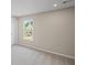 A bedroom with neutral walls and plush carpet and a view of the neighborhood at 123 Cherry Glen Way, Euharlee, GA 30145