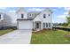 Charming two-story home featuring a classic color scheme, well-manicured lawn and a two car garage at 123 Cherry Glen Way, Euharlee, GA 30145