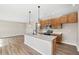 Stylish kitchen boasts a large island with a sink, stainless steel appliances, and abundant counter space at 123 Cherry Glen Way, Euharlee, GA 30145
