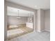 Open-concept living space features a kitchen island and living room area filled with natural light at 123 Cherry Glen Way, Euharlee, GA 30145