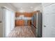 Modern kitchen featuring stainless steel appliances and wood-look flooring at 1421 Bay Overlook Dr, Woodstock, GA 30188