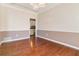 Bright dining room with hardwood floors and a view of the kitchen at 4140 Cherry Ridge Walk, Suwanee, GA 30024