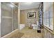 Bathroom with shower/tub combo, toilet and window at 872 Brafferton Pl, Stone Mountain, GA 30083