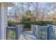 Deck access to backyard via ramp, surrounded by trees at 2599 Browns Mill Se Rd, Atlanta, GA 30354