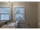 Bathroom with granite countertop and updated fixtures at 2599 Browns Mill Se Rd, Atlanta, GA 30354