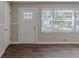 Bright entryway with hardwood floors, white door, and large windows at 2599 Browns Mill Se Rd, Atlanta, GA 30354
