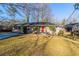 Brick ranch home with a red front door and spacious yard at 2599 Browns Mill Se Rd, Atlanta, GA 30354