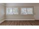 Spacious living room with hardwood floors and multiple windows at 2599 Browns Mill Se Rd, Atlanta, GA 30354