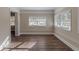 Sunroom featuring hardwood floors and ample natural light at 2599 Browns Mill Se Rd, Atlanta, GA 30354