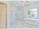 Luxurious bathroom featuring a soaking tub and glass shower at 590 Clubwood Ct, Marietta, GA 30068