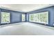 Spacious bedroom with blue walls and plush carpeting at 590 Clubwood Ct, Marietta, GA 30068