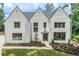 White brick home with a charming front porch at 590 Clubwood Ct, Marietta, GA 30068