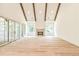 Spacious Gathering room with hardwood floors, exposed beams, and a fireplace at 590 Clubwood Ct, Marietta, GA 30068