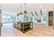 Large kitchen island, hardwood floors, and open to Gathering room at 590 Clubwood Ct, Marietta, GA 30068