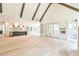 Open concept kitchen and Gathering room with hardwood floors and exposed beams at 590 Clubwood Ct, Marietta, GA 30068