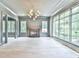 Bright living room with hardwood floors, fireplace, and large windows offering ample natural light at 590 Clubwood Ct, Marietta, GA 30068