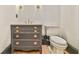 Powder room with dark gray vanity, marble countertop, and updated fixtures at 590 Clubwood Ct, Marietta, GA 30068
