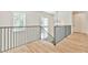Modern staircase with metal railing and hardwood floors at 590 Clubwood Ct, Marietta, GA 30068