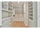Spacious walk-in closet with ample shelving and drawers at 590 Clubwood Ct, Marietta, GA 30068