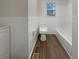 Clean bathroom featuring a toilet, bathtub, and vinyl floors at 555 Bridge Ave, Forest Park, GA 30297