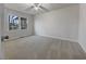 A sunlit bedroom featuring modern flooring, a window view, and a spacious feel ready for personalization and comfortable living at 555 Bridge Ave, Forest Park, GA 30297