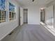 Carpeted bedroom with a window, closet, and doorways to other rooms at 555 Bridge Ave, Forest Park, GA 30297