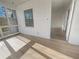 Bright and airy sun room with wood floor, offering a cozy, light-filled transition between the indoors and outdoors at 555 Bridge Ave, Forest Park, GA 30297