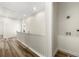 Upper hallway with white railing, utility connections and hardwood flooring at 3603 Brycewood Dr, Decatur, GA 30034