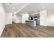 Open-concept living space with island kitchen, hardwood floors, and recessed lighting throughout the space at 3603 Brycewood Dr, Decatur, GA 30034