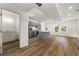 Inviting living room with hardwood floors, recessed lighting, and an adjacent kitchen with stainless appliances at 3603 Brycewood Dr, Decatur, GA 30034