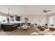 Open concept dining and living area with a wooden table and chairs, connected to the kitchen at 1341 Grannysmith Trce # 45, Brookhaven, GA 30319