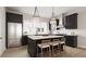 Modern kitchen with dark cabinetry, stainless steel appliances, and an island at 1341 Grannysmith Trce # 45, Brookhaven, GA 30319