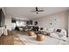 Open concept living room and kitchen, featuring a white sectional sofa and wood accents at 1341 Grannysmith Trce # 45, Brookhaven, GA 30319
