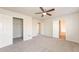 Spacious bedroom with carpeting, ceiling fan, and walk-in closet at 850 Oxford Hall Dr, Lawrenceville, GA 30044
