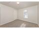 Bright bedroom with a window and carpet flooring at 850 Oxford Hall Dr, Lawrenceville, GA 30044