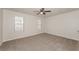 Bright bedroom with neutral carpeting and ceiling fan at 850 Oxford Hall Dr, Lawrenceville, GA 30044