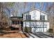 White two-story house with attached garage and deck at 850 Oxford Hall Dr, Lawrenceville, GA 30044