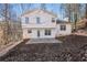 Two-story house with backyard patio and wooded view at 850 Oxford Hall Dr, Lawrenceville, GA 30044