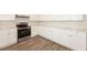 Modern kitchen with white cabinets and stainless steel appliances at 850 Oxford Hall Dr, Lawrenceville, GA 30044