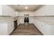 Renovated kitchen featuring white cabinets and stainless steel appliances at 850 Oxford Hall Dr, Lawrenceville, GA 30044