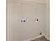 Laundry room with built-in shelving and hookups at 850 Oxford Hall Dr, Lawrenceville, GA 30044