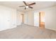 Spacious main bedroom with carpet, ceiling fan and access to bathroom at 850 Oxford Hall Dr, Lawrenceville, GA 30044