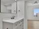 Bright bathroom featuring a vanity and access to bedroom at 860 Peachtree Ne St # 1617, Atlanta, GA 30308