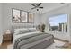 Spacious bedroom with large window and city views; virtually staged at 860 Peachtree Ne St # 1617, Atlanta, GA 30308